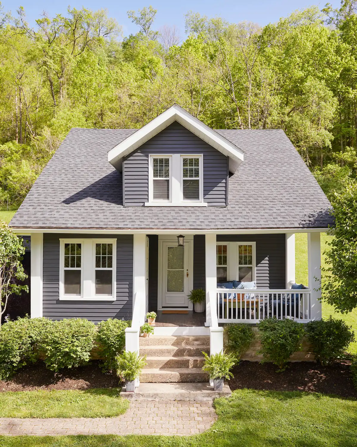 A tidy white colonial house — the kind we don't expect yours to look like